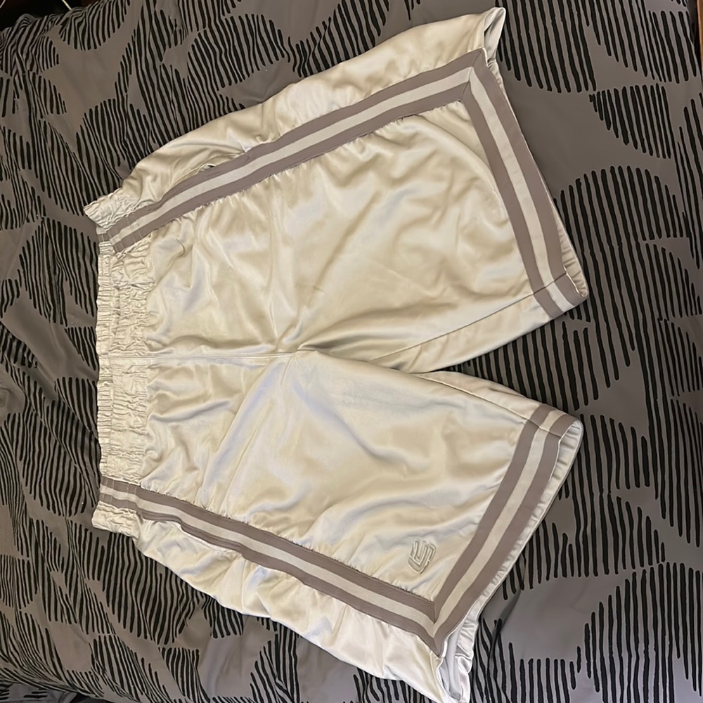 White Nike basketball shorts with gray accents